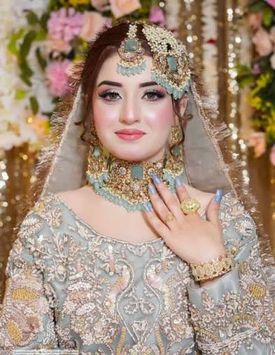 Bridal makeup with pastel outfit and floral backdrop